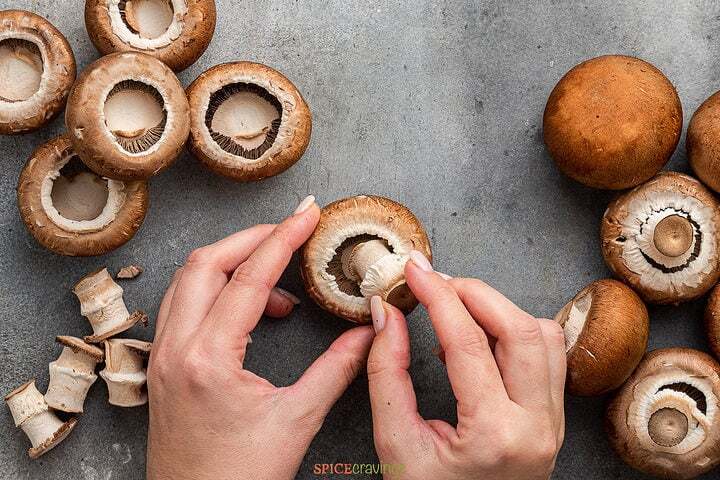 White Fuzz on Mushroom stem - Safe to eat or should I throw it away? White Fuzz on Mushroom stem - Safe to eat or should I throw it away?